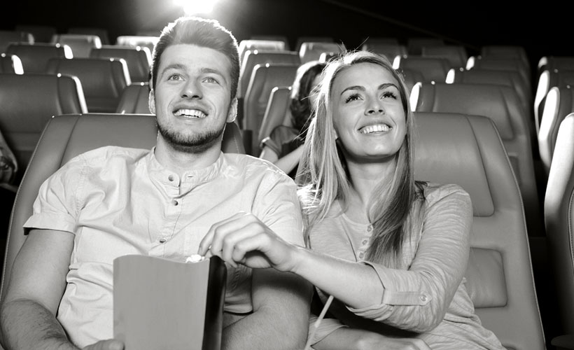 wedding couple at the movies because of gift from the photographer